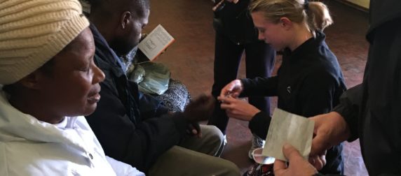 Don and Carolyn giving out eyeglasses